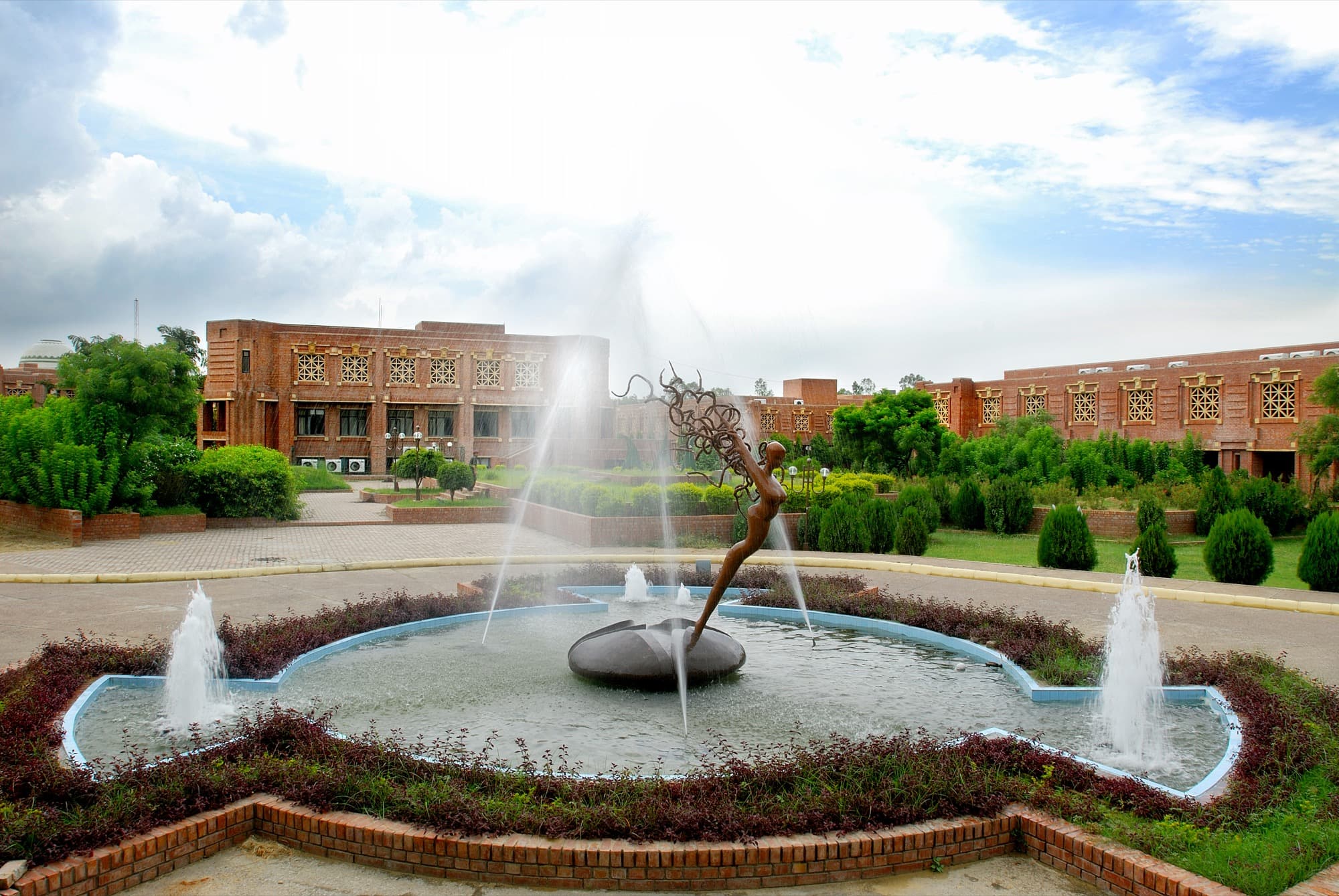 The fountain court and red-brick campus of IIM Lucknow